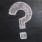 A question mark drawn on a chalkboard